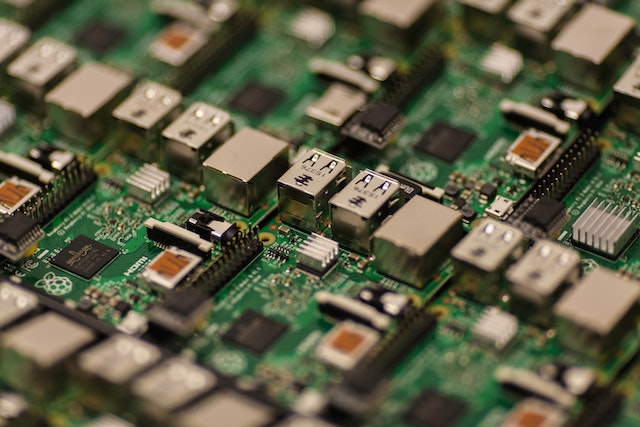 "Close-up view of multiple green circuit boards with various electronic components and connectors."